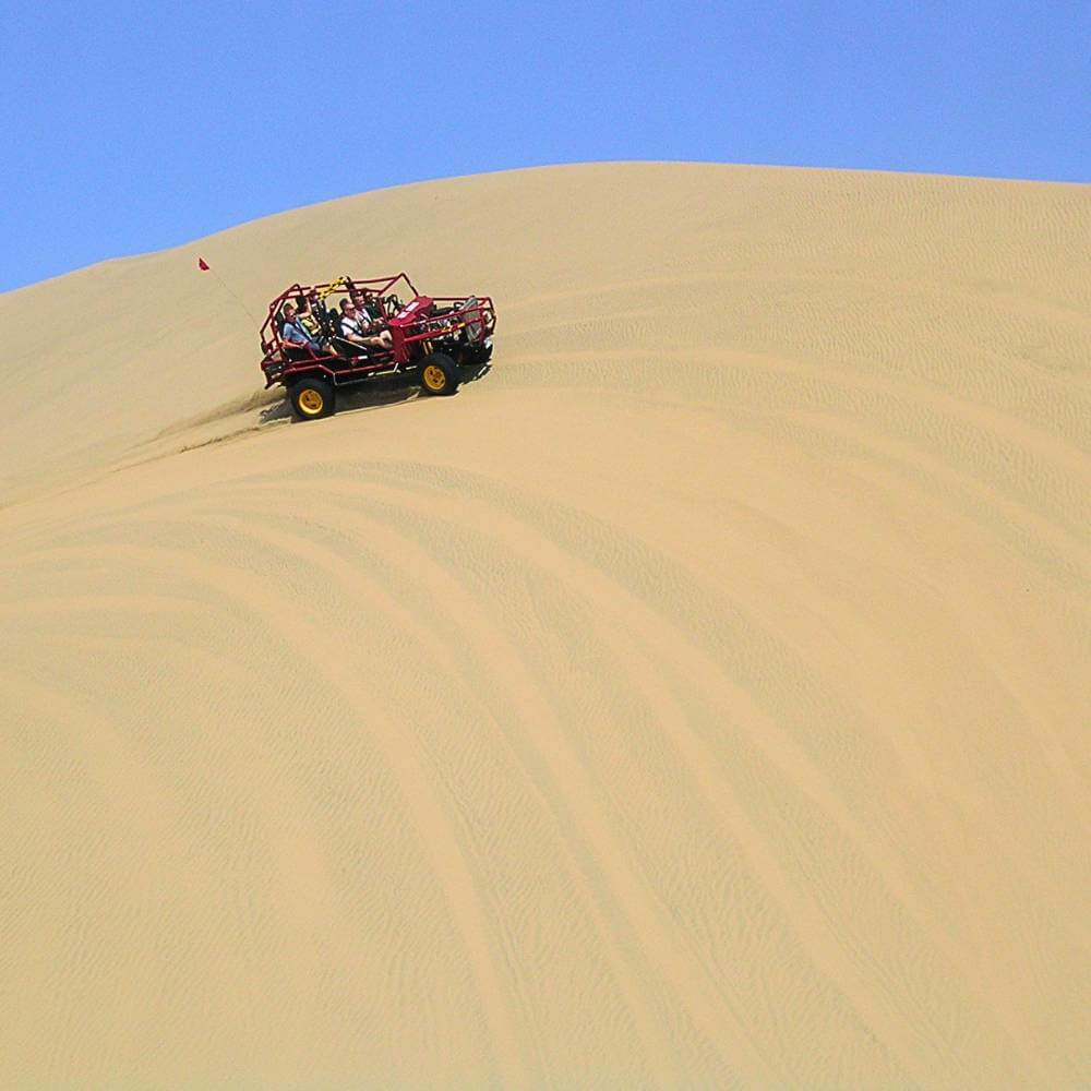 Dune buggy ride across the giant sand dunes of Huacachina Oasis Peru