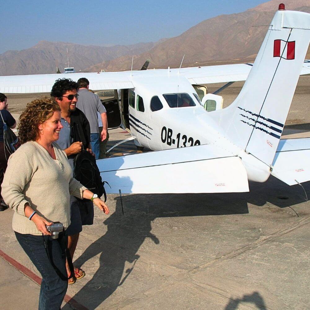 Passengers boarding a small aircraft for a Nazca Lines flight over Peru's UNESCO World Heritage geoglyphs.