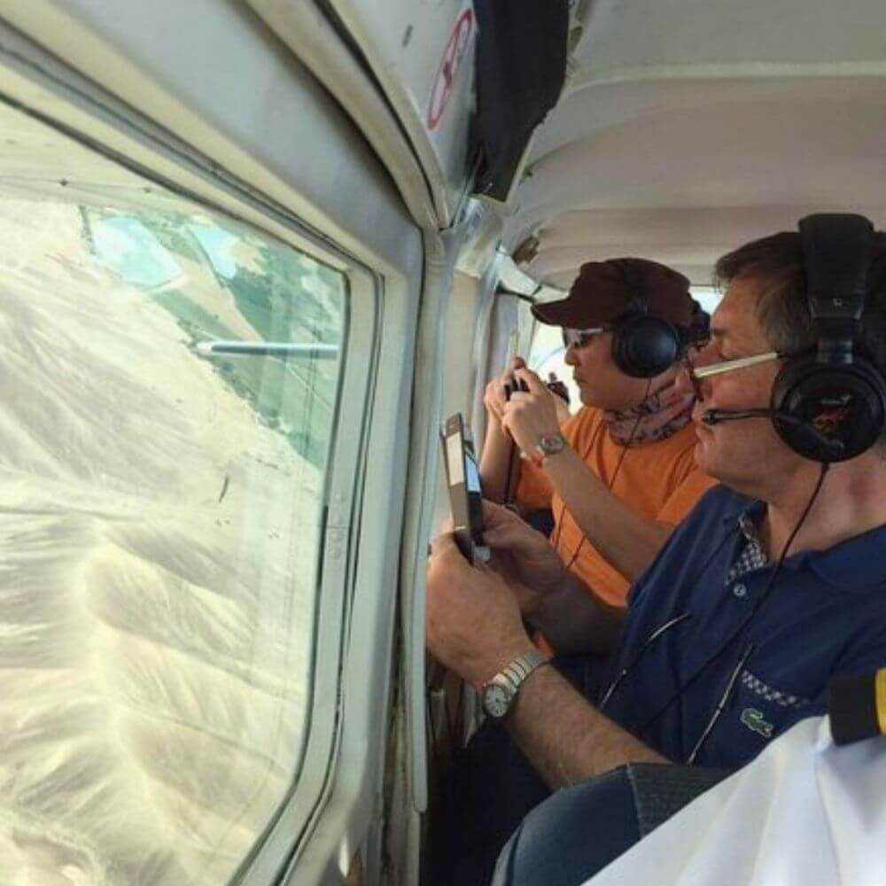 Tourists enjoying a Nazca Lines flight tour over the ancient geoglyphs in Peru