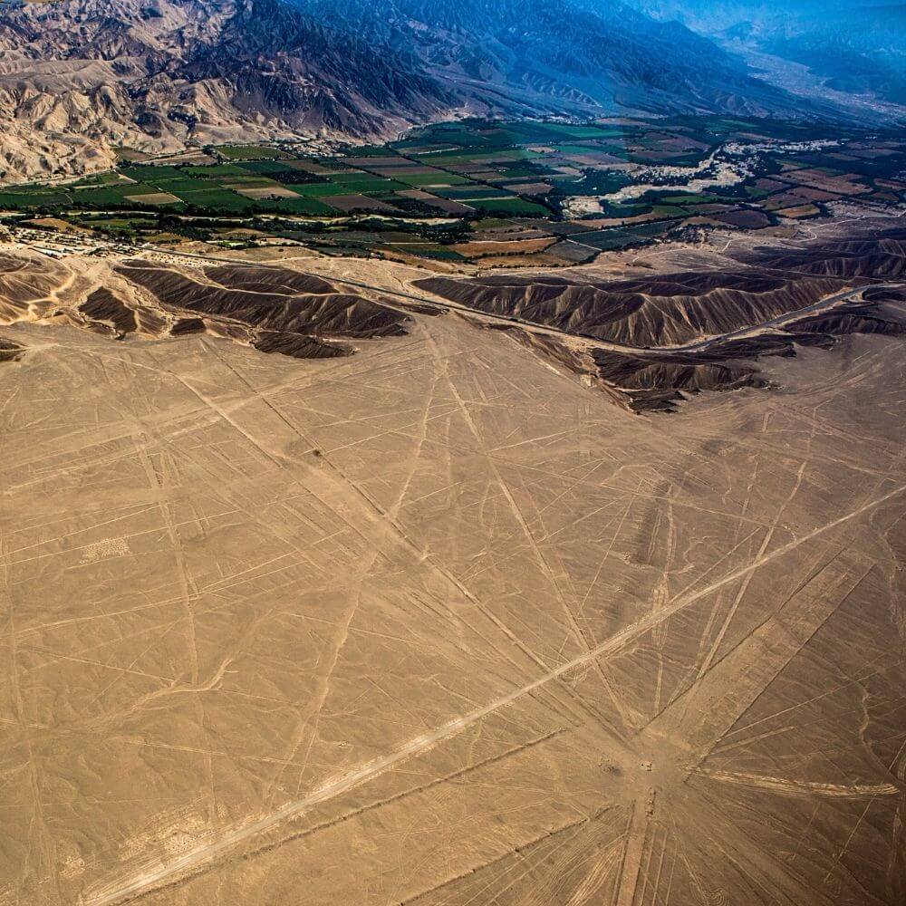 Panoramic aerial view of the Nazca desert and ancient geoglyphs in Peru