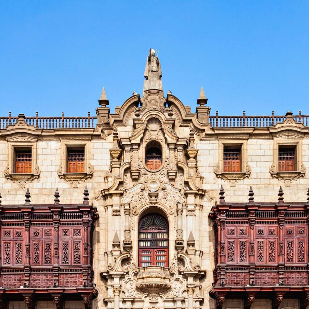 Government Palace of Peru in Lima Historic Center featuring elegant Baroque architecture and traditional wooden balconies.