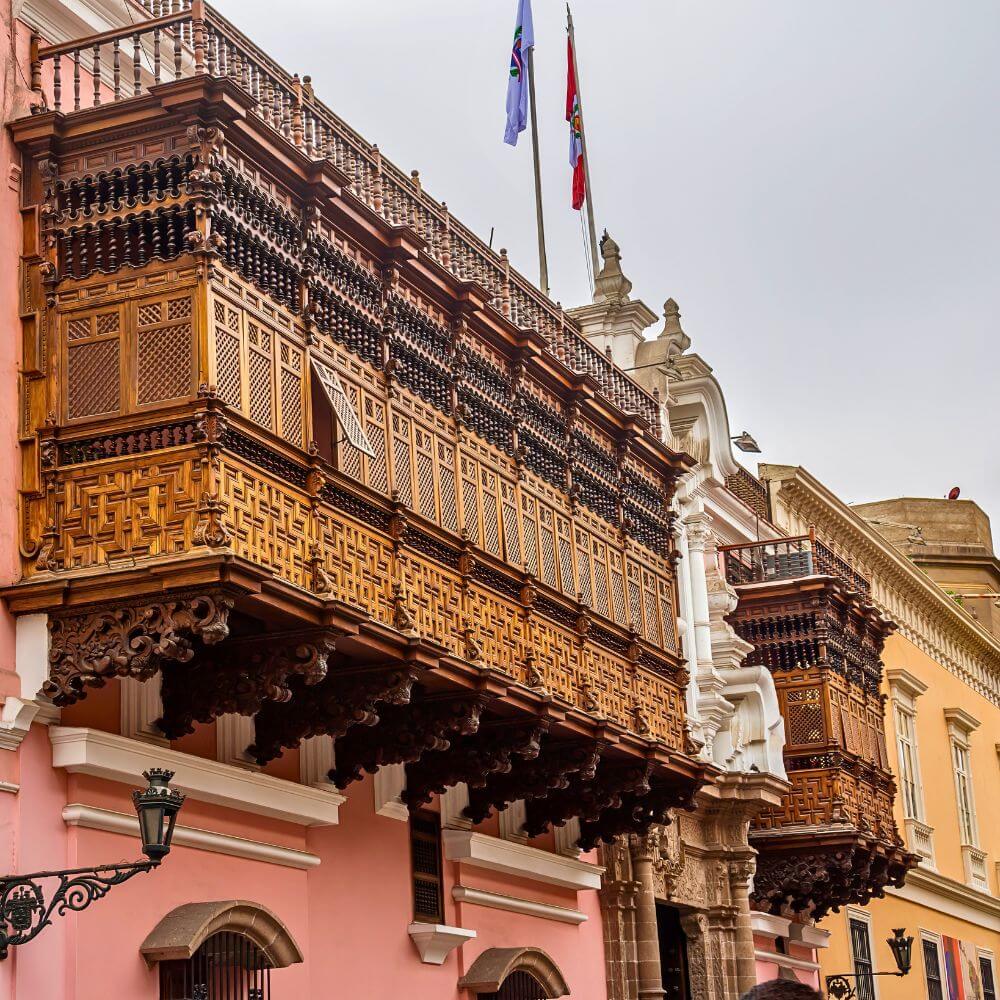 Beautiful carved wooden balconies decorating colonial buildings in the UNESCO Historic Center of Lima, Peru.