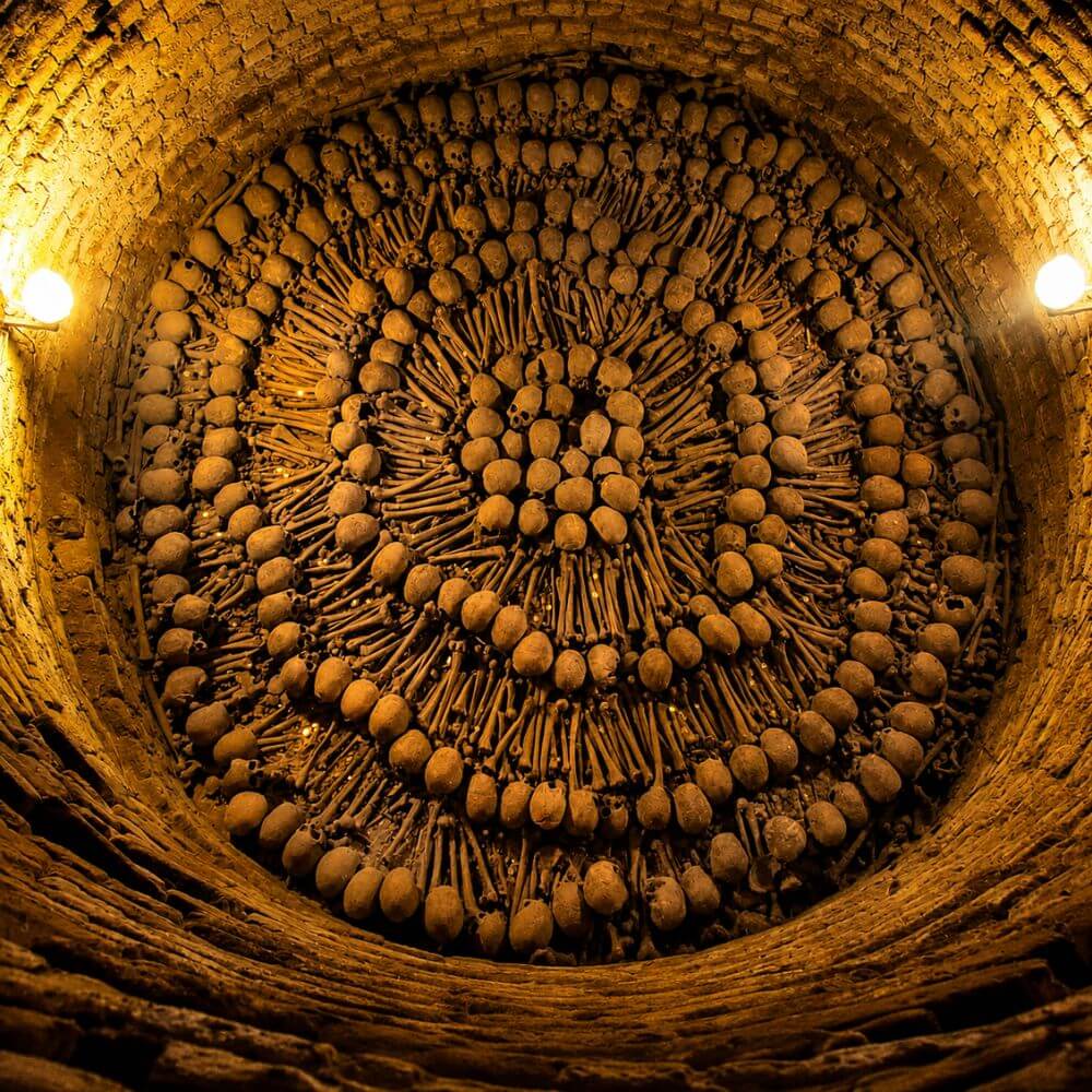 Historic human remains arranged inside the ancient catacombs beneath the San Francisco Monastery in Lima.