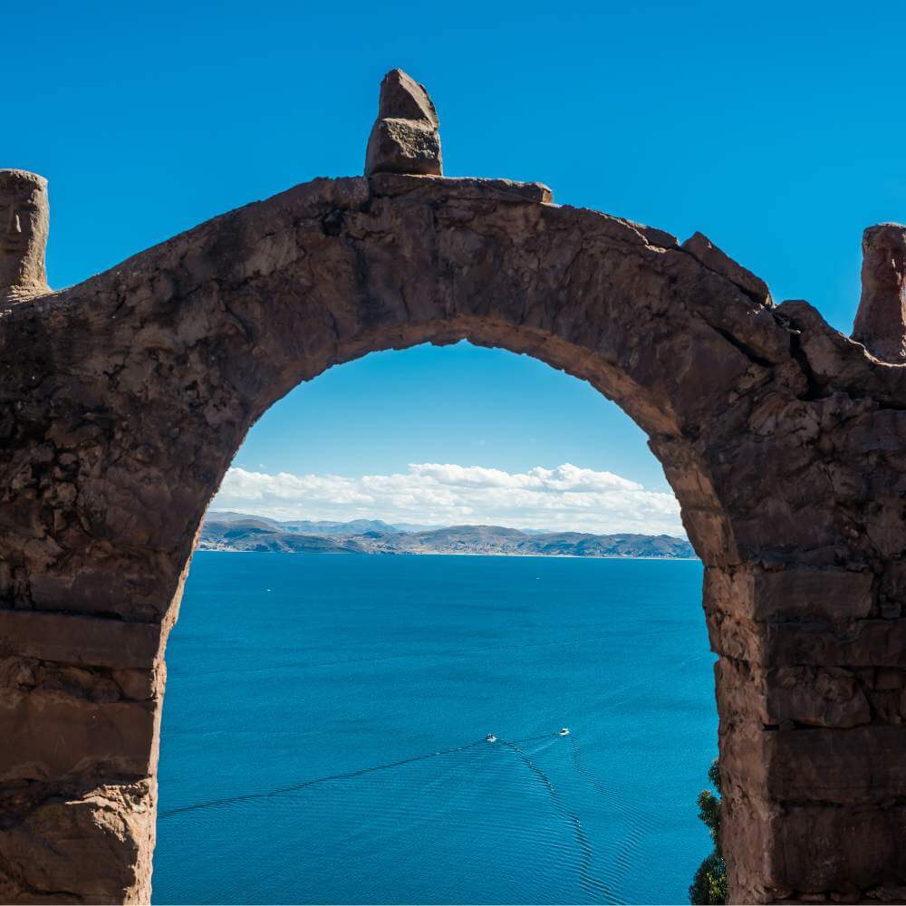 Historic stone arch overlooking Lake Titicaca on Taquile Island during a Lake Titicaca Full Day Tour in Peru.