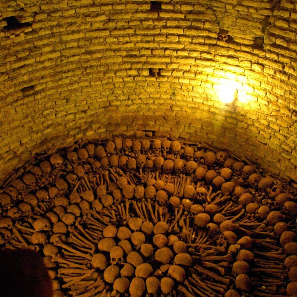 Ancient human remains displayed inside the San Francisco Catacombs during a Lima Tour by Night in Lima, Peru.