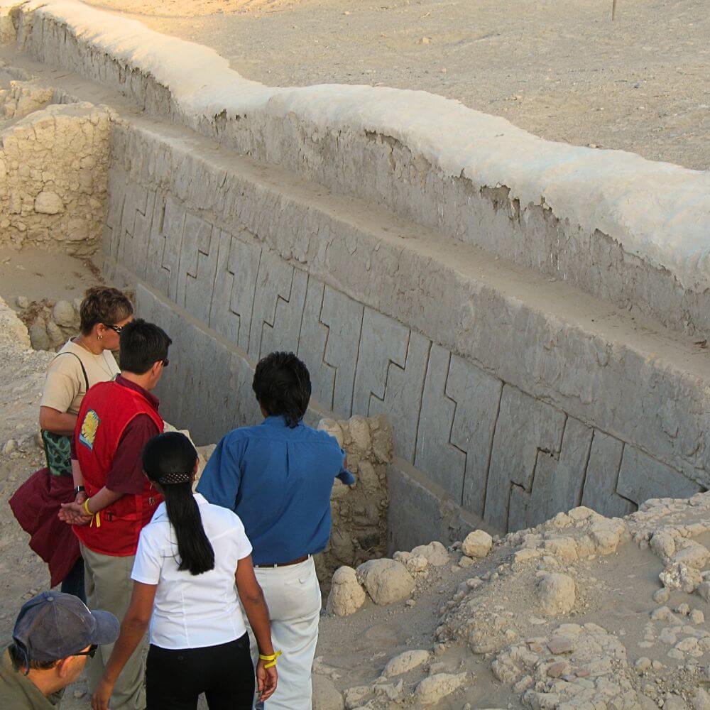 Ancient adobe wall with Nazca designs at Cahuachi archaeological site