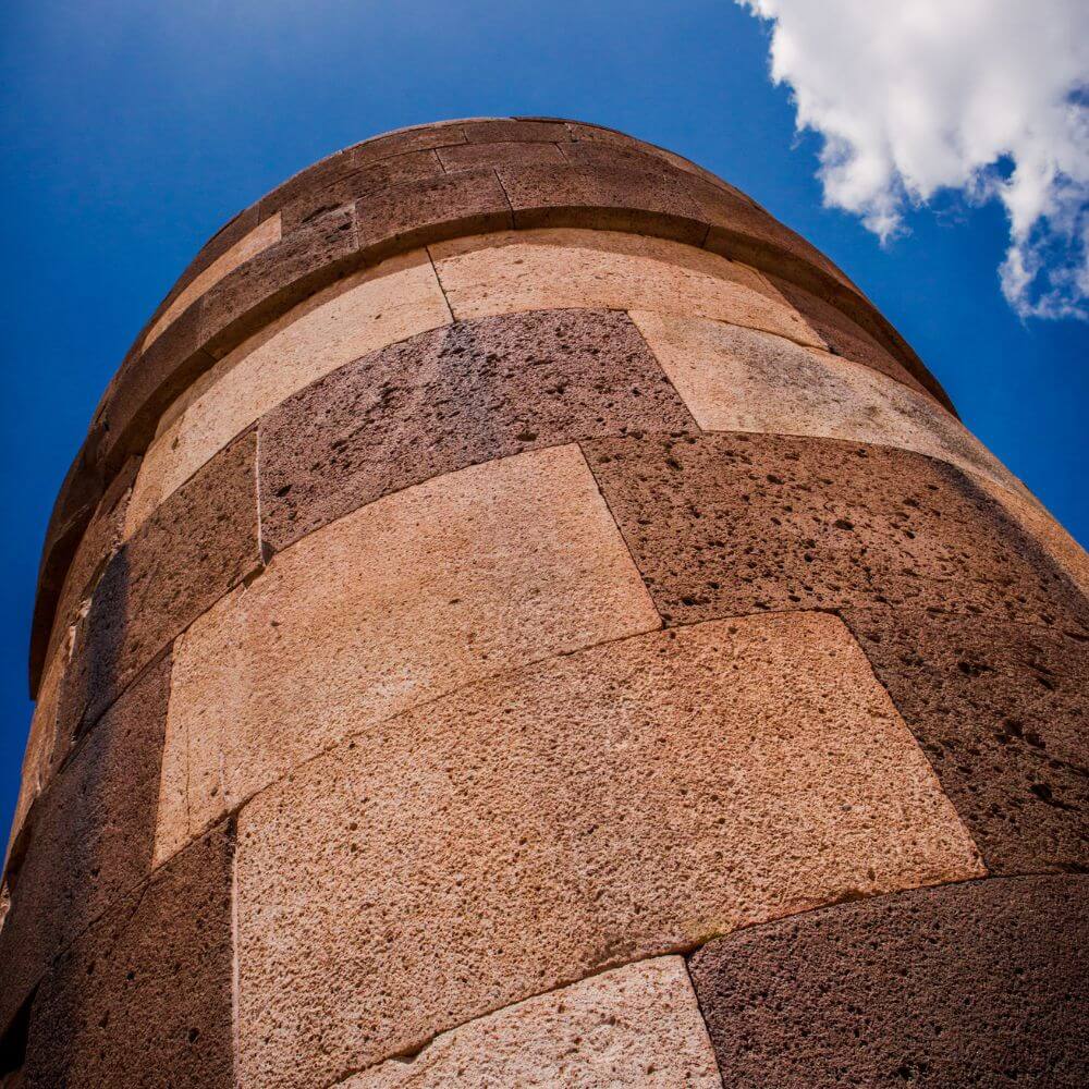 Close-up view of the massive stone masonry of the Sillustani Burial Towers, showcasing the exceptional craftsmanship of the ancient Colla civilization in Peru.