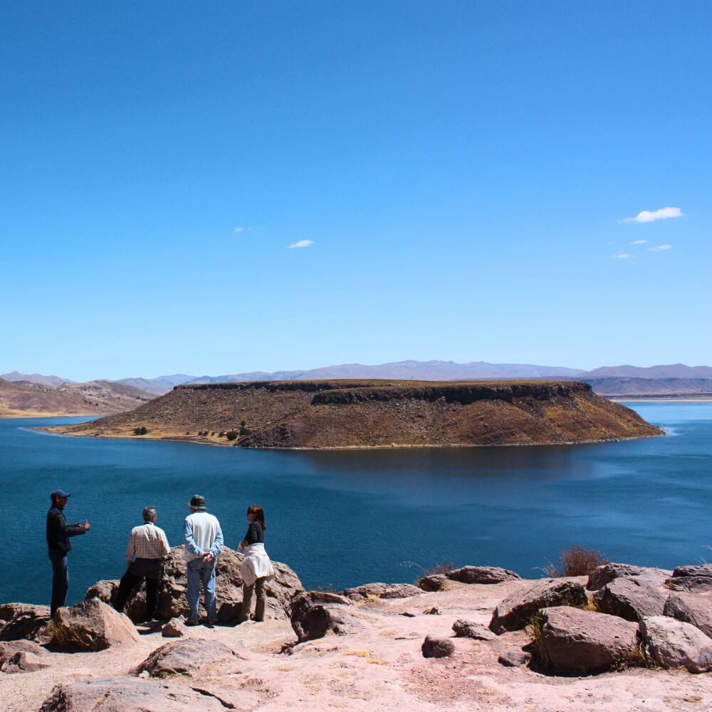 Panoramic view of Lake Umayo from the Sillustani Archaeological Site near Puno, Peru, surrounded by dramatic Andean scenery.