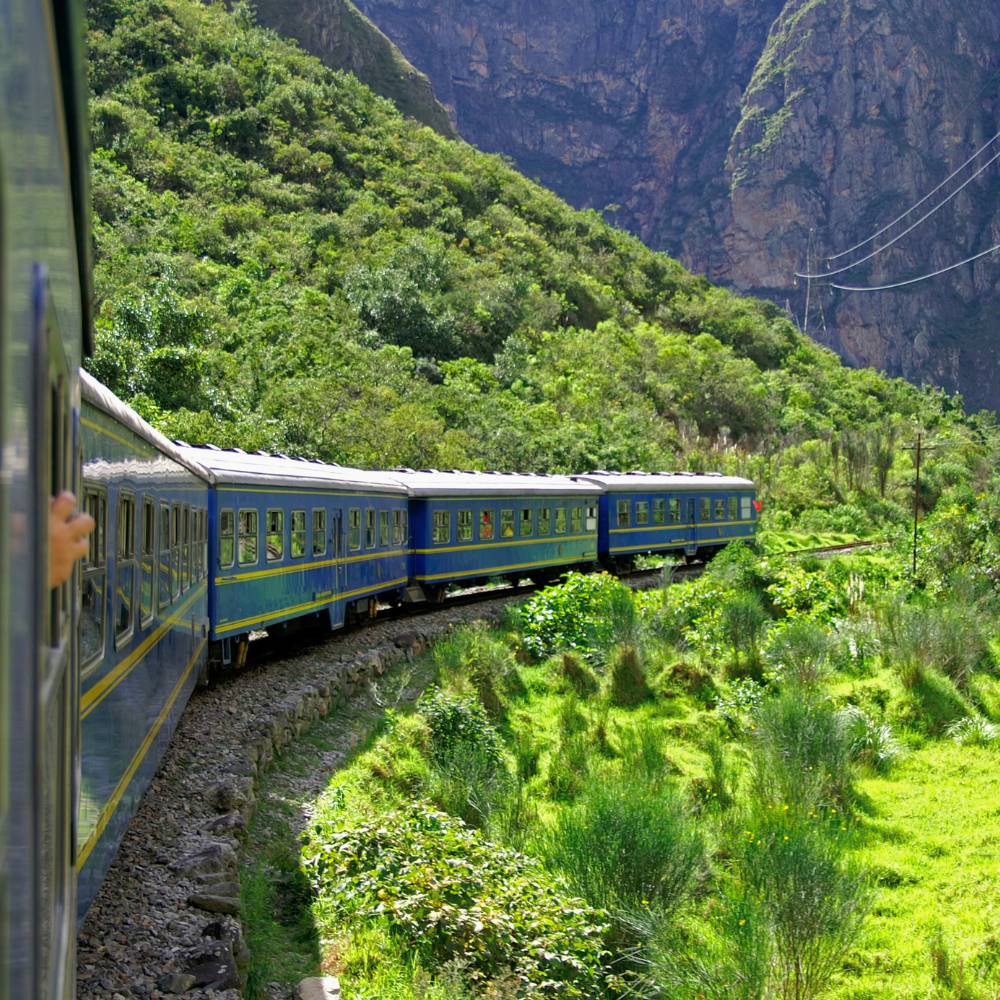 Train traveling through the breathtaking Sacred Valley on the journey to Machu Picchu Full Day Tour from Cusco, Peru.