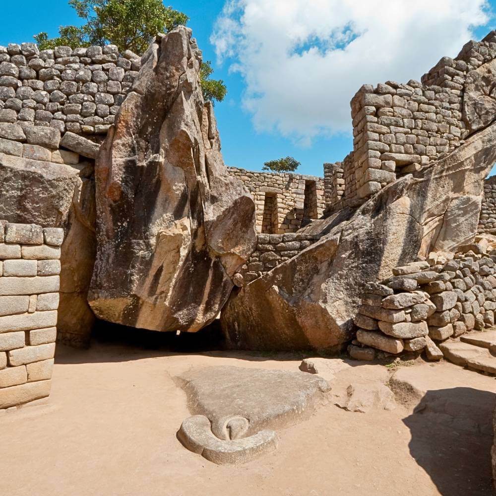 The Temple of the Condor at Machu Picchu featuring sacred Inca stone carvings and ceremonial architecture.