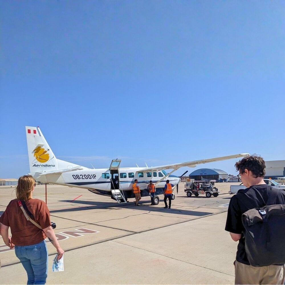 Travelers boarding a panoramic aircraft for a Nazca Lines Flight from San Martin Port before an unforgettable aerial tour over Peru's ancient geoglyphs.