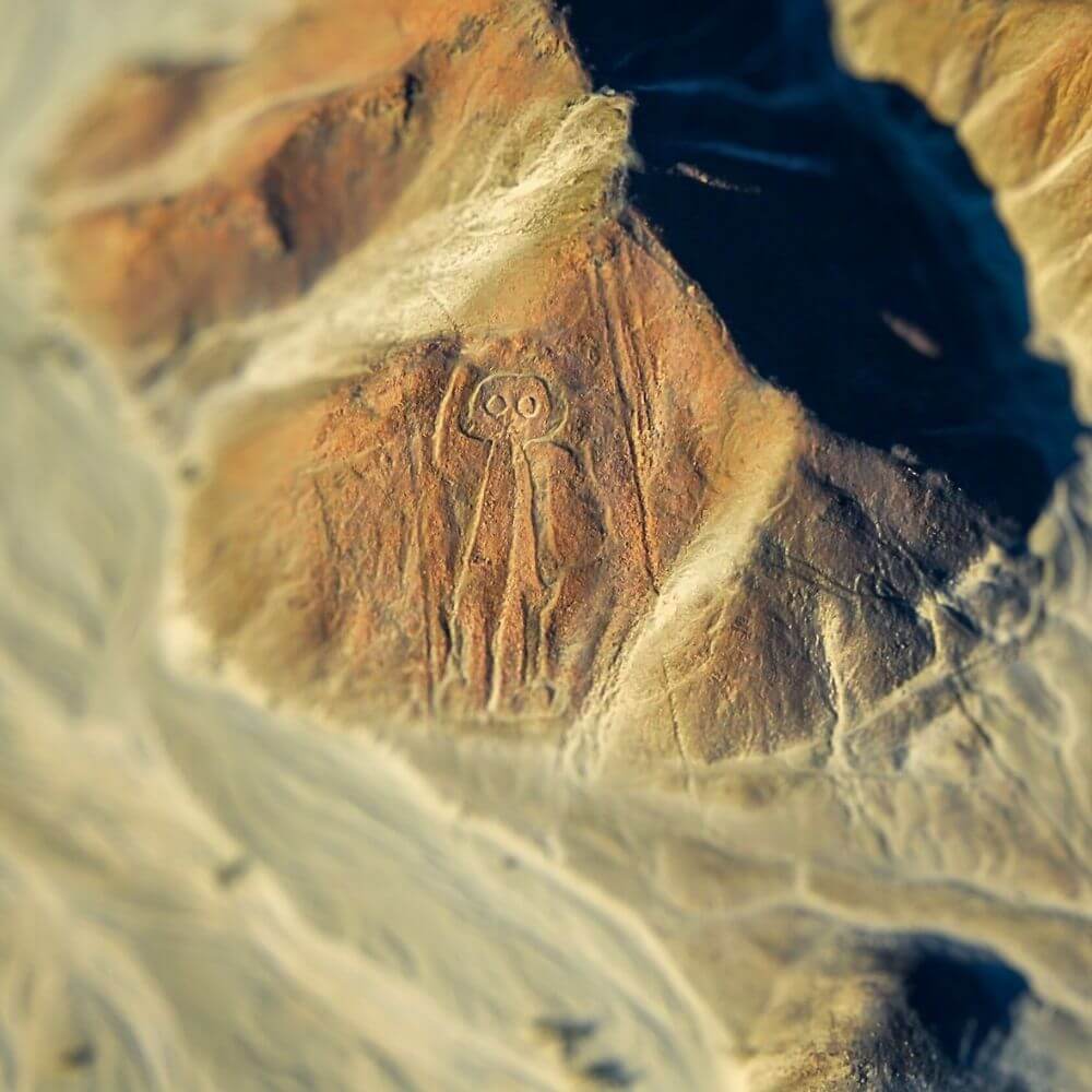Aerial view of the famous Astronaut geoglyph in the Nazca Desert, one of the most mysterious Nazca Lines figures in Peru.
