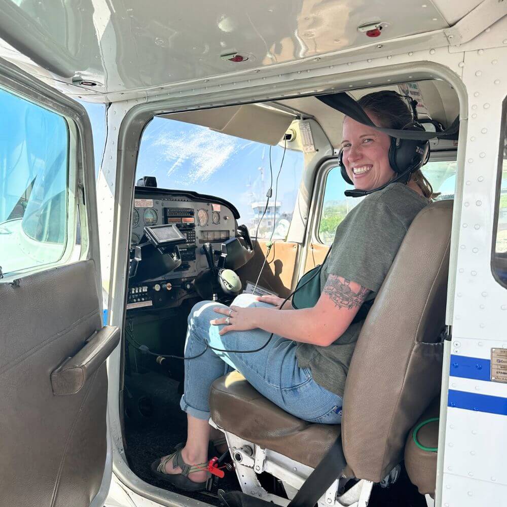 Traveler boarding a light aircraft for a Nazca Lines private flight experience in southern Peru.