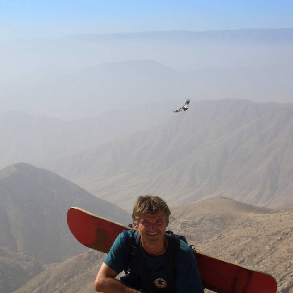 Sandboarder watching an Andean Condor on Cerro Blanco.