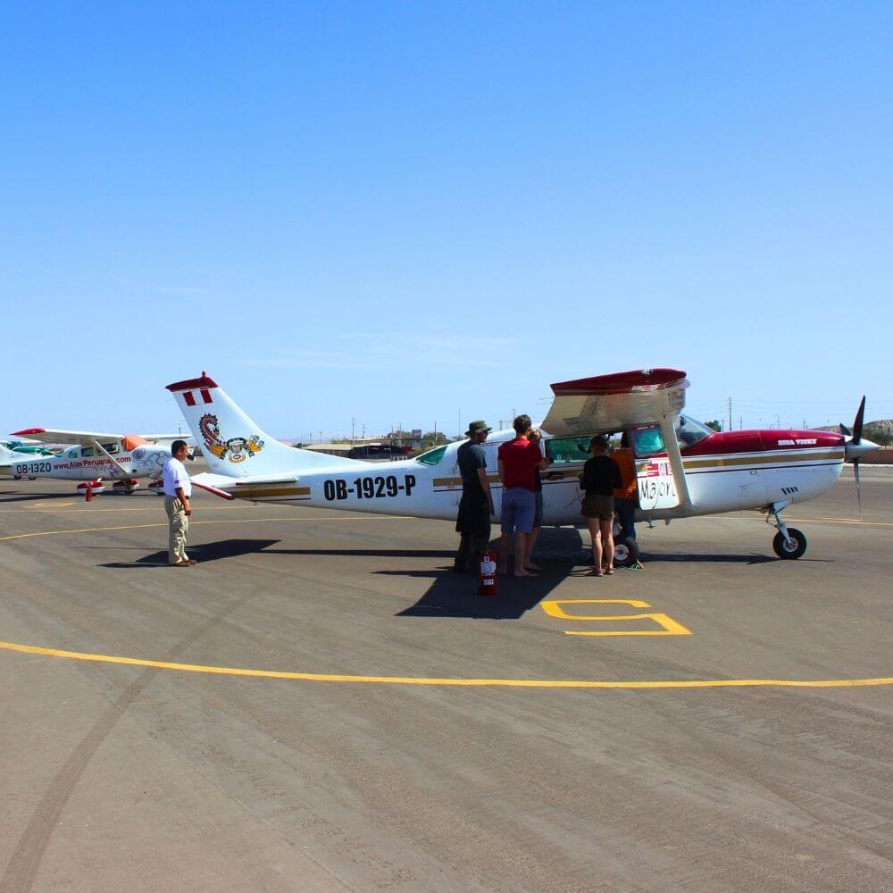 Travelers boarding a sightseeing aircraft before a Nazca Lines flight during the NAZCA LINES TOUR FROM AREQUIPA.