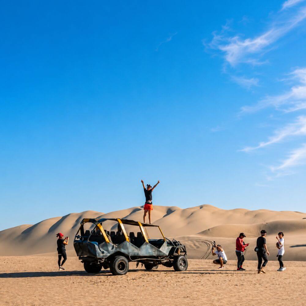 Aerial view of the hidden Oasis Morón lagoon surrounded by towering sand dunes on the Oasis Morón Tour from Paracas.