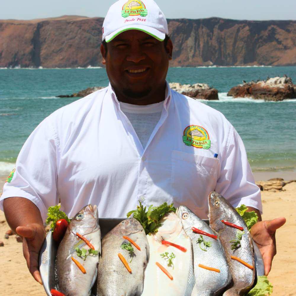 Fresh seafood prepared at a waterfront restaurant in Lagunillas Fishing Village during a Paracas Bay Tour, Peru.