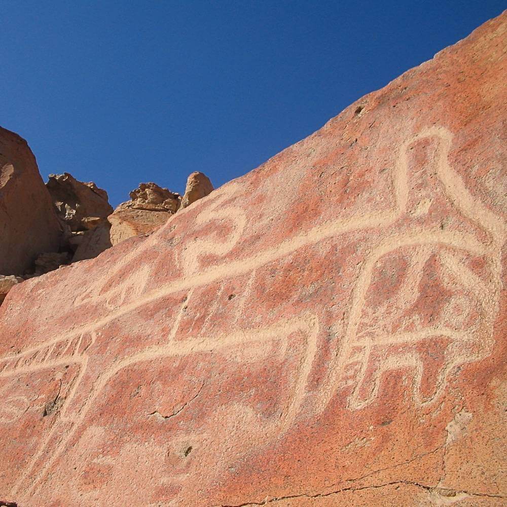 Ancient hillside petroglyph at Chicchitara, an important archaeological site linked to the early development of the Nazca geoglyph tradition in Peru.