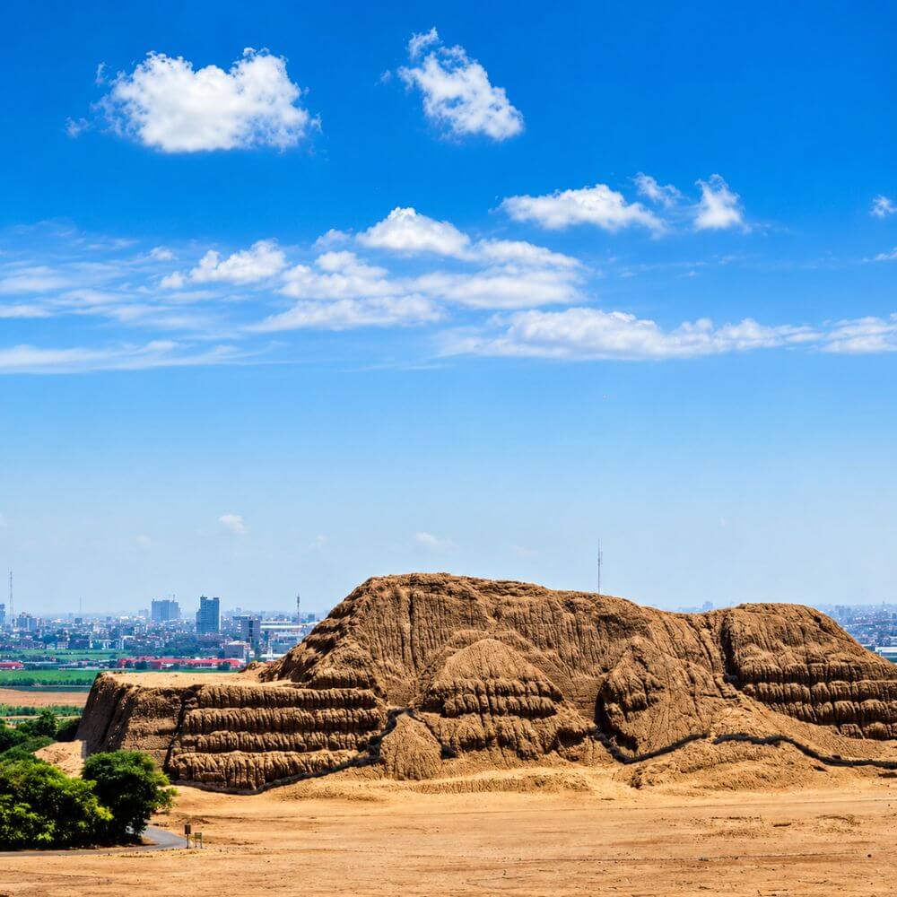 Panoramic view of Huaca del Sol, the monumental adobe pyramid of the ancient Moche civilization near Trujillo, Peru.
