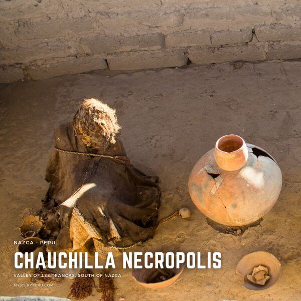 Mummy with ancient pots and relics in a grave of Chauchilla in Nazca.