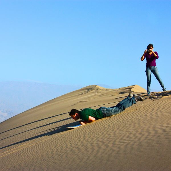 Sandboarding experience in Huacachina Desert.