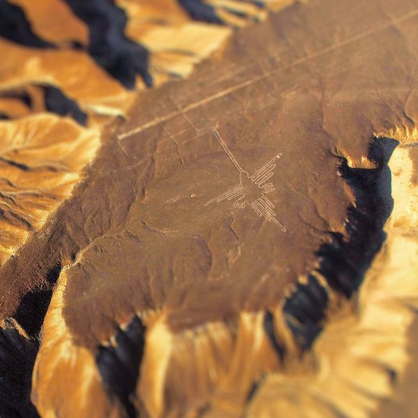 Aerial tour over the Hummingbird figure in the Nazca Desert.