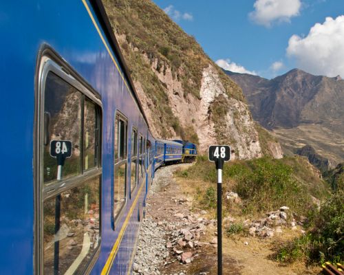 Scenic train ride from Cusco to Machu Picchu through the Andes.