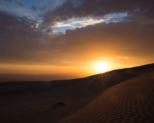 Catch a breathtaking sunrise over Cerro Blanco