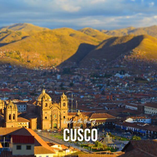 Panoramic view of Cusco, the historic Inca capital, with colonial architecture and surrounding mountains.