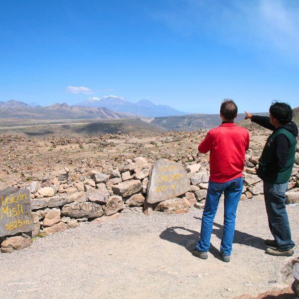 Tourists admire volcanoes on the Colca Canyon Tour from Arequipa