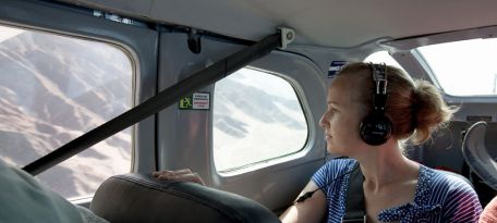 Tourist flying over the Nazca Lines desert