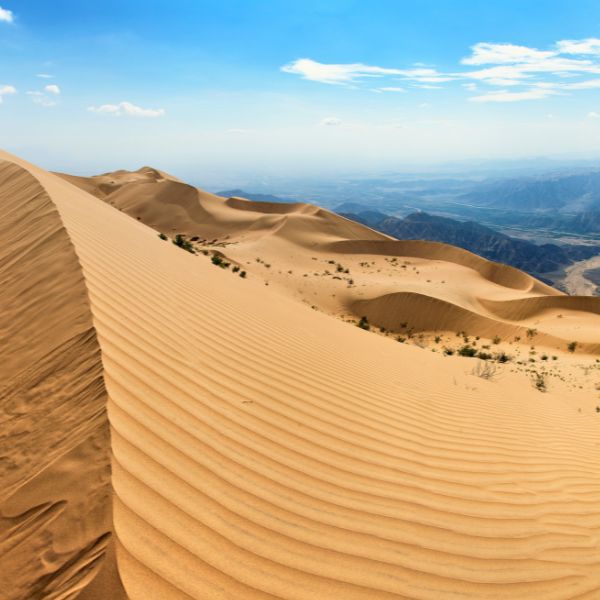 Panoramic view of Cerro Blanco dune and Nazca Valley in the distance