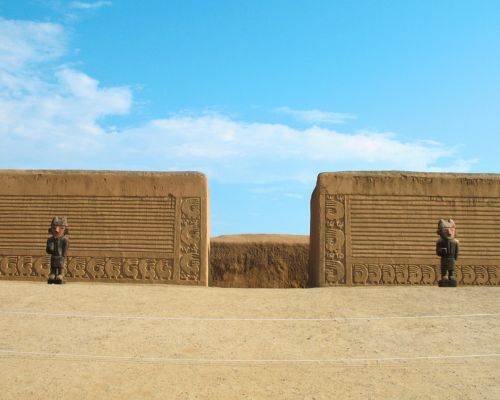 Monumental entrance flanked by guardian figures at Chan Chan