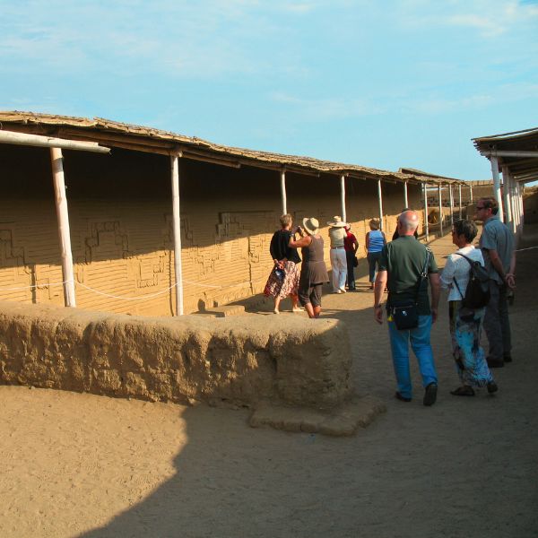 Guided tour along decorated adobe walls of Chan Chan