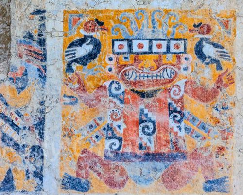 Iconic Moche deity mural with vibrant colors