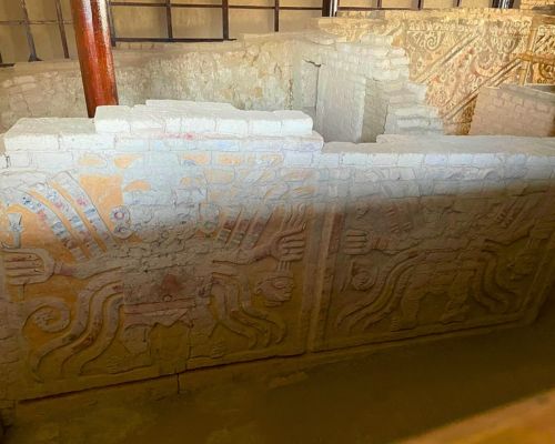 Carved reliefs of mythological figures at El Brujo