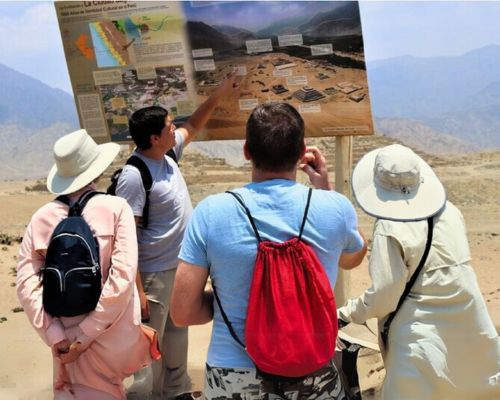 Guide presenting the layout of Caral to curious travelers