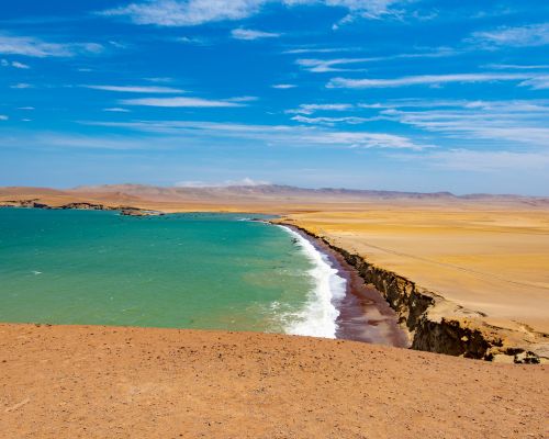 Red Beach (Playa Roja) with its iconic red sand and ocean waves