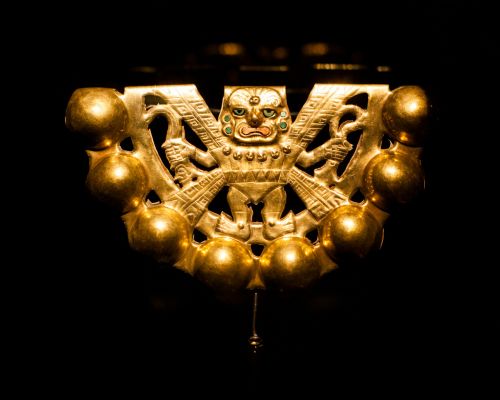Gold pectoral ornament on display at the Royal Tombs of Sipán Museum