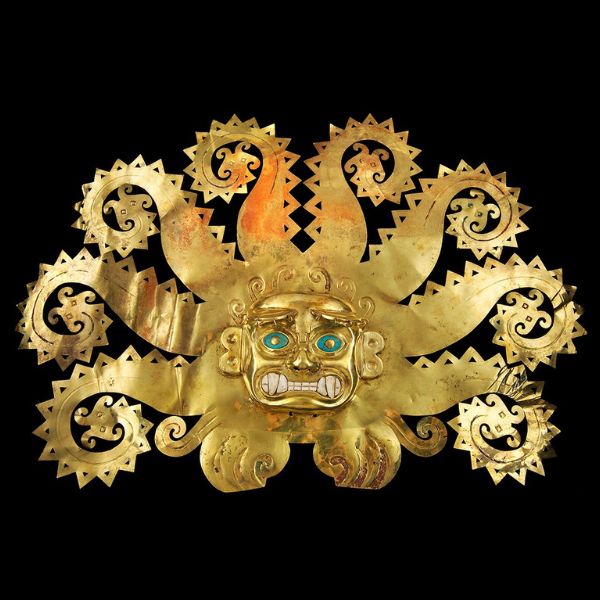 Ornate golden headdress of the Moche deity with turquoise eyes