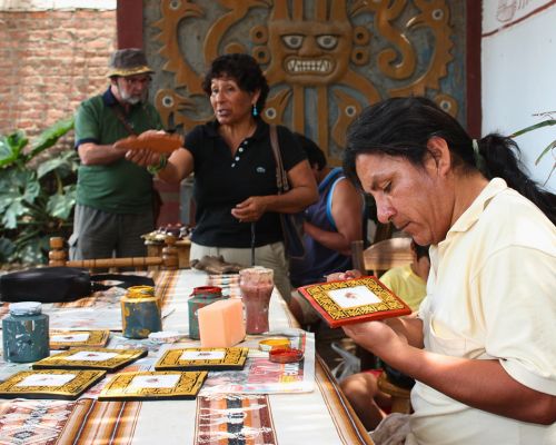 Artisan demonstrating ancient Moche pottery techniques.