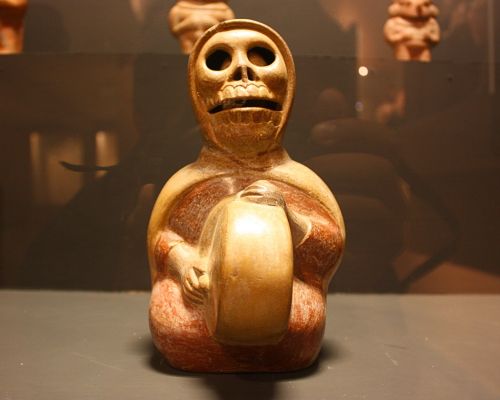 Ceramic figure with skull-like face at Trujillo museum
