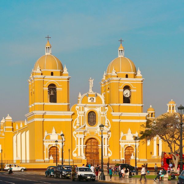 Bright yellow Cathedral of Trujillo facing the main square